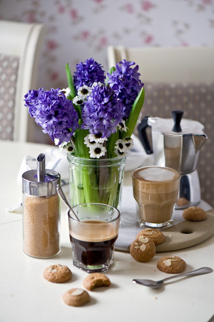 Still life with hyacinths, coffee, and cookies