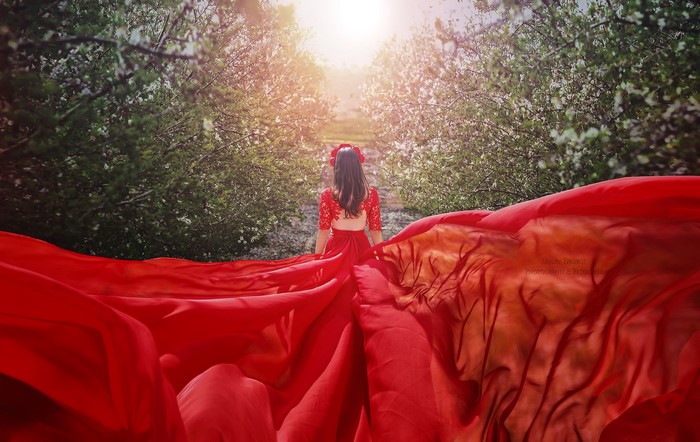 Malika Drobot in a red dress