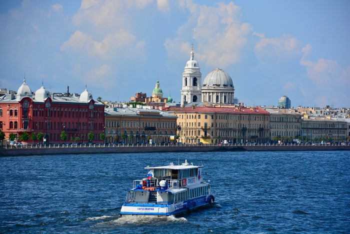 Riverboat on Neva River with St. Petersburg skyline