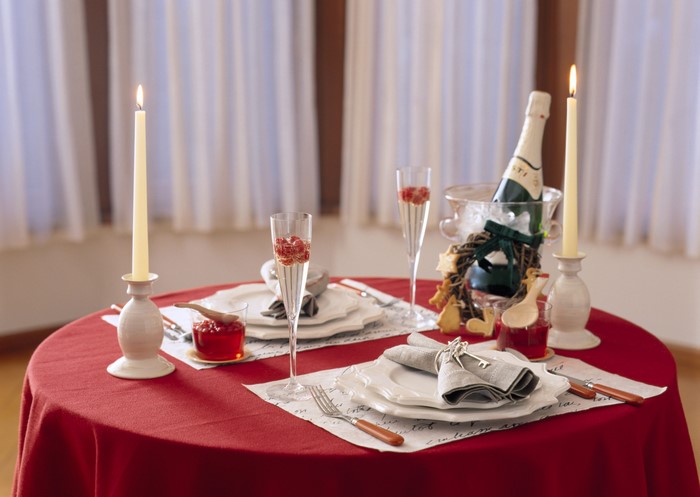 Romantic table setting with champagne and candles
