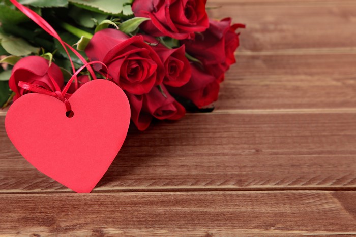 Red Roses and Heart Tag on Wood Planks