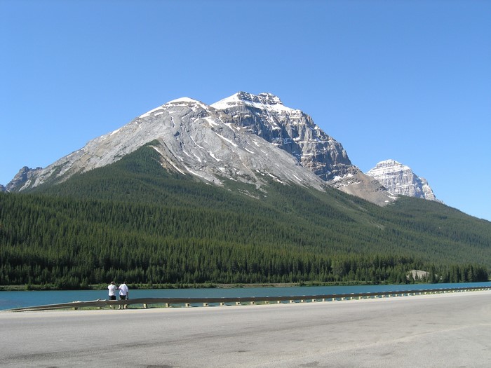 Mountains and lake with two people in British Columbia