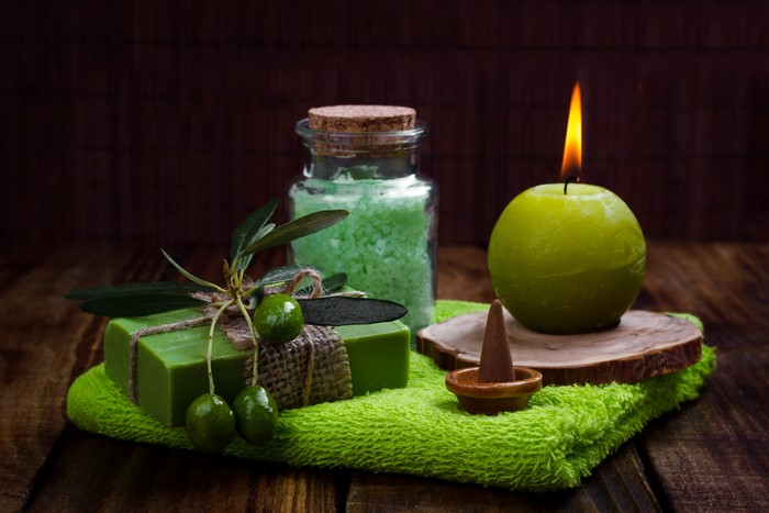 Spa items: soap, salt, candle, and olives