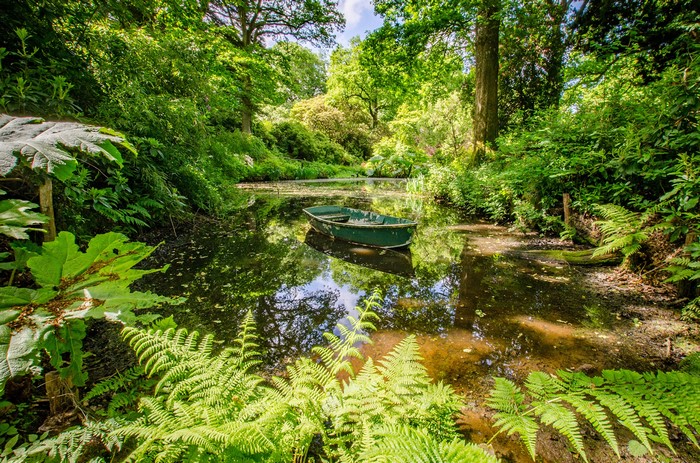 Boat on a pond in Ramster Gardens, England