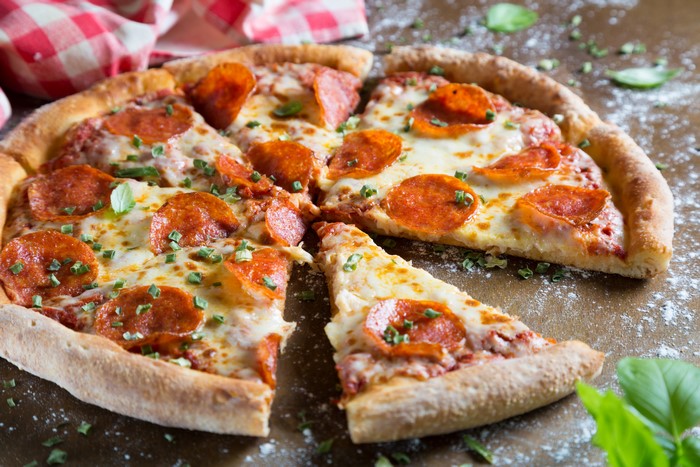 Pepperoni Pizza Slice with Green Garnish