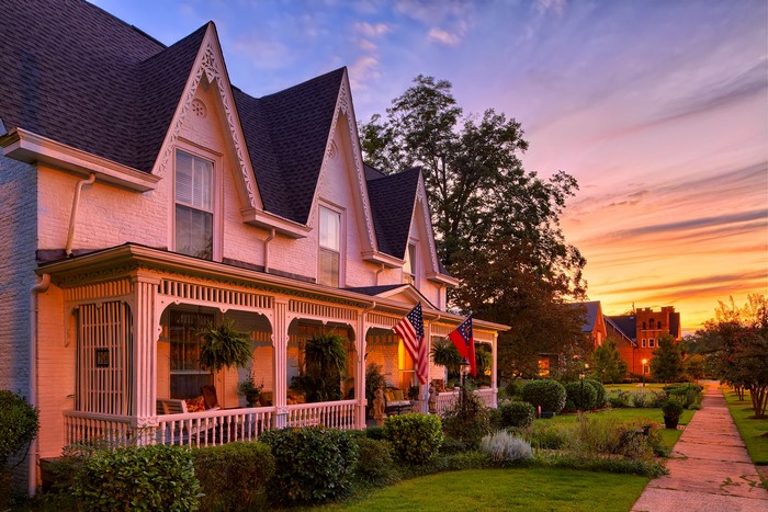 Victorian house with flags at sunset in West Point, Georgia