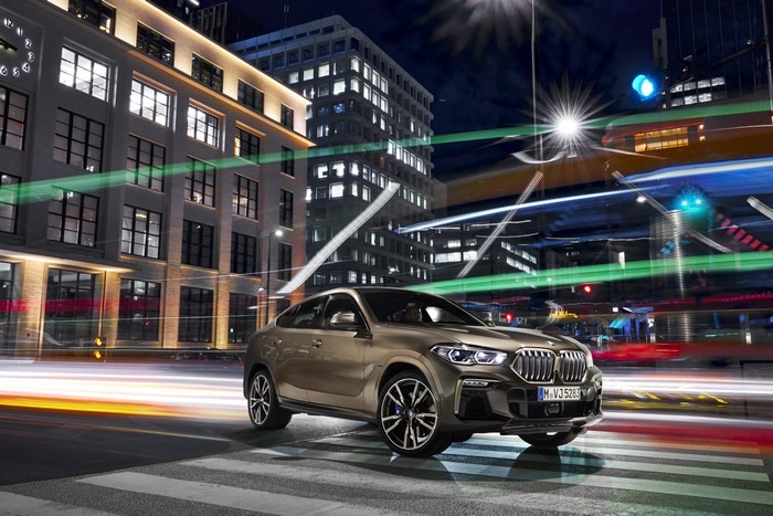 BMW X6 M50i Crossover in City at Night