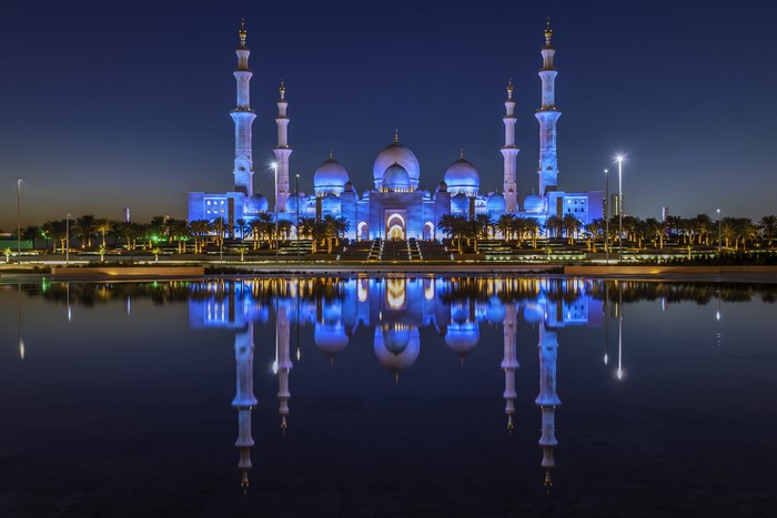 Sheikh Zayed Grand Mosque at night with reflection
