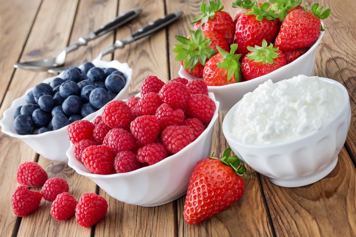 Berries and Cream on Wood Planks