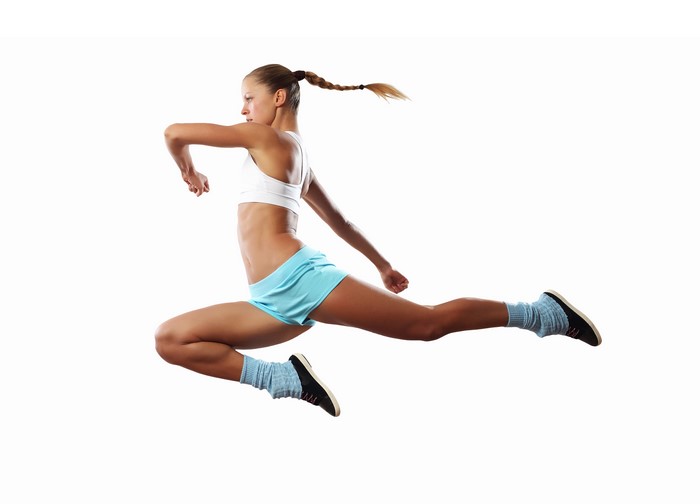 Woman in workout clothes jumping