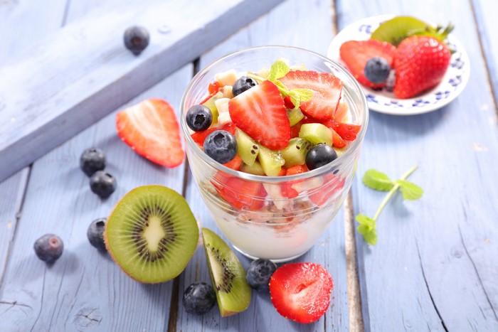 Fruit salad with yogurt, strawberries, blueberries, and kiwi