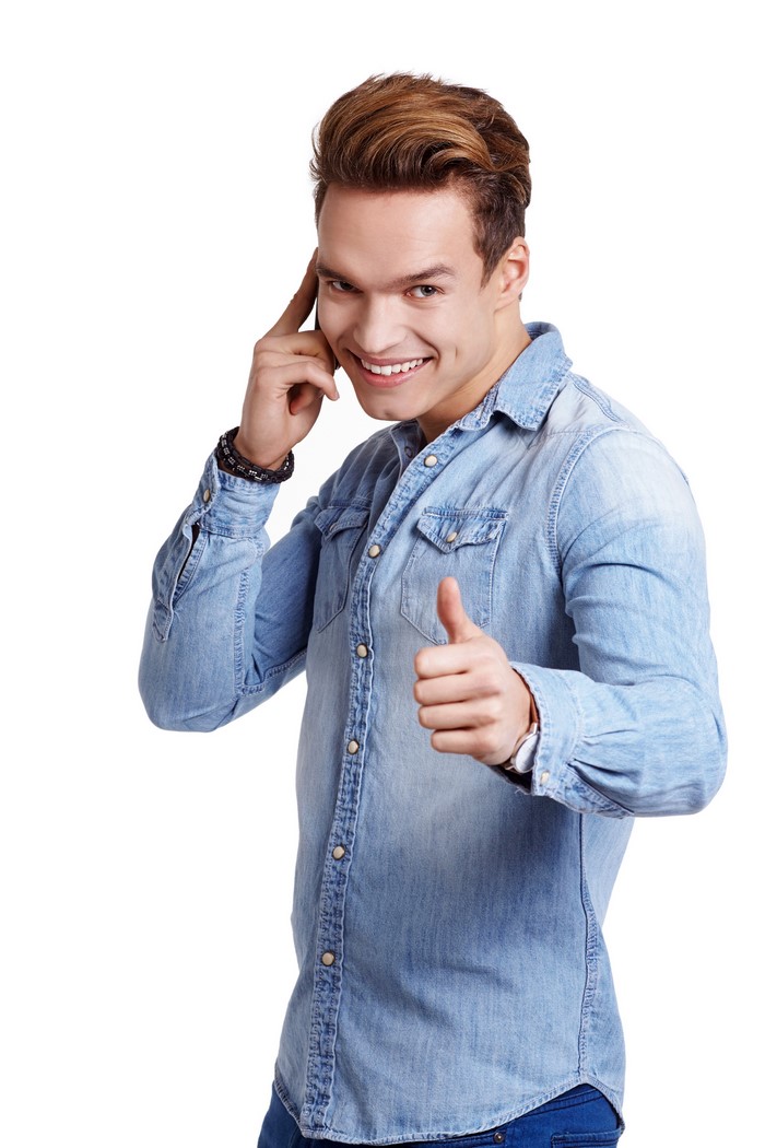 Man in denim shirt giving thumbs up