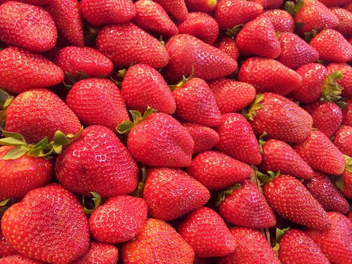 A close-up view of many fresh strawberries