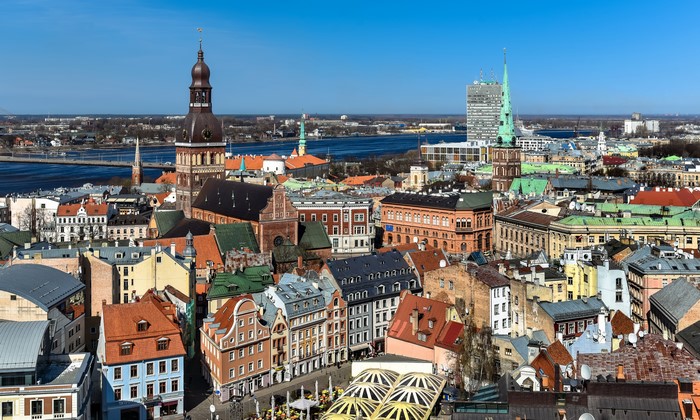 Riga, Latvia cityscape with historic buildings and river