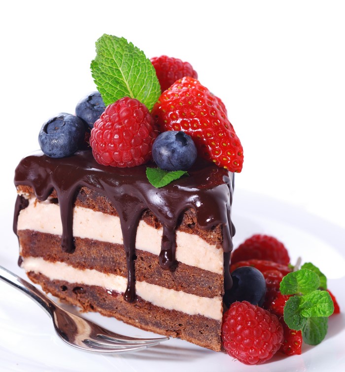 Chocolate cake with berries and mint