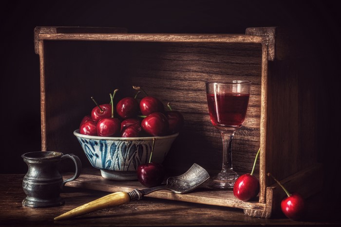 Still life with cherries, wine, and a mug