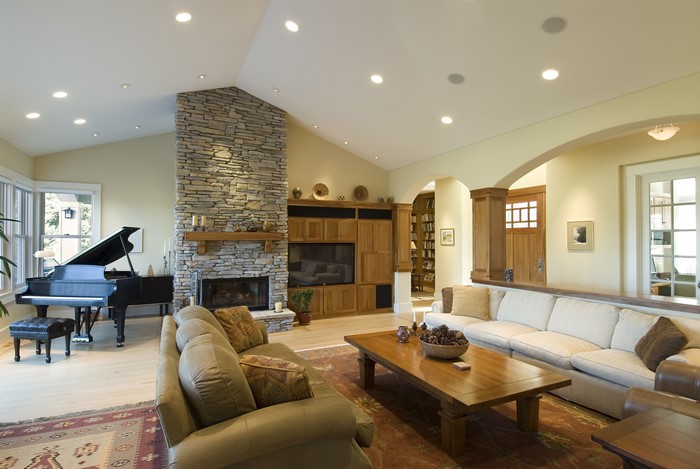 Living room with grand piano and fireplace