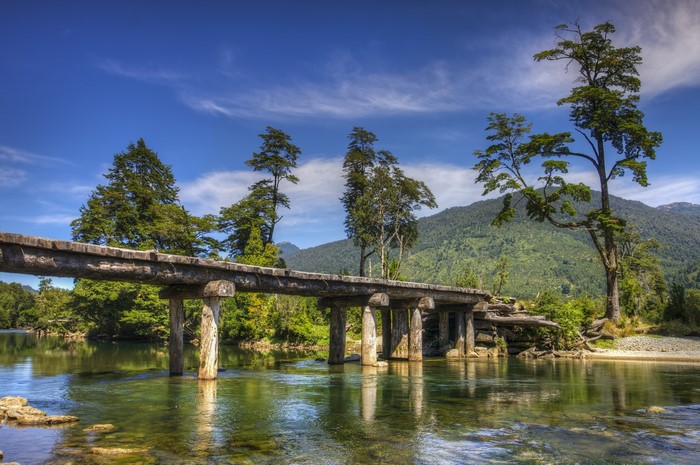 Wooden bridge over a river in Patagonia, Chile