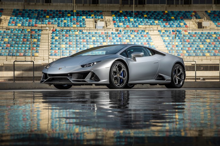 Grey Lamborghini on a wet racetrack