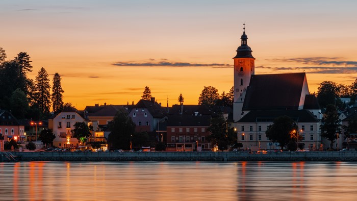 Town with Church on River at Sunset