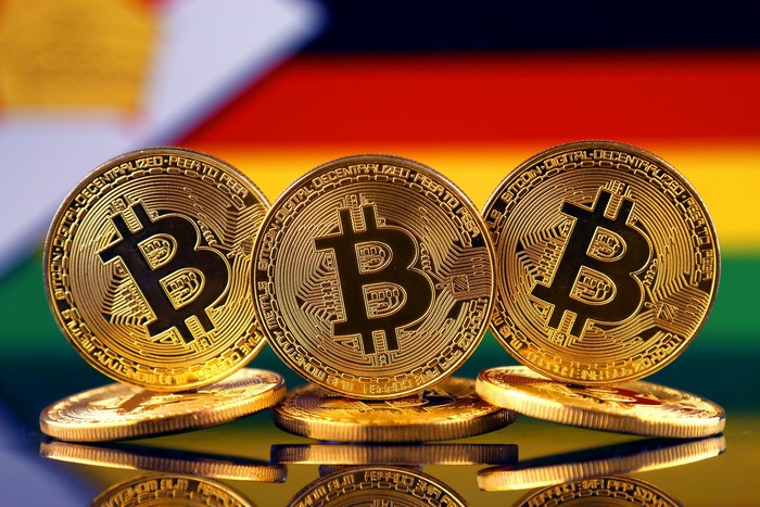 Bitcoin coins on a colorful background