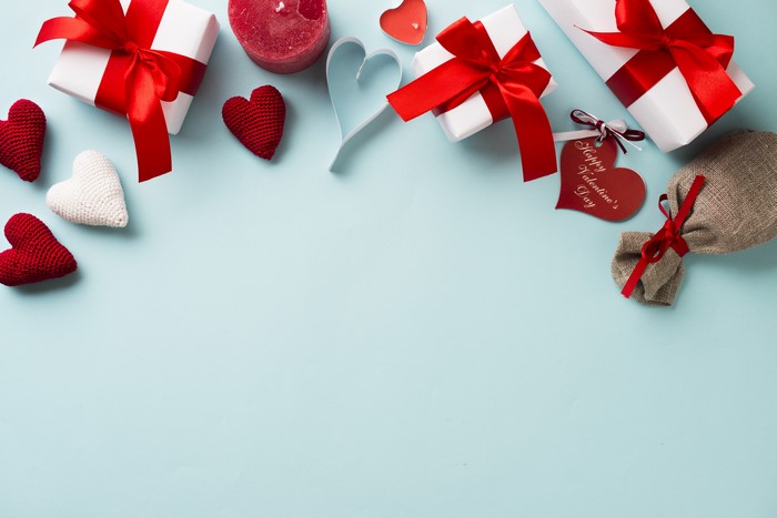 Valentine's Day gifts and hearts on a blue background