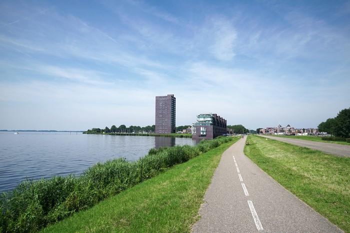 Apartment buildings by a lake in Almere City, Netherlands