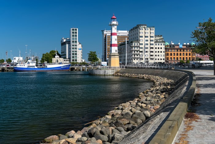 Lighthouse and boats in a Swedish harbor