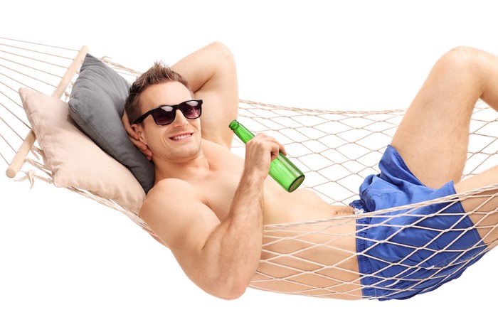 Man in Hammock with Sunglasses and Beer Bottle