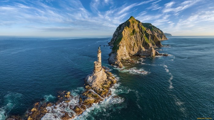 Lighthouse on a rocky island near Sakhalin, Russia