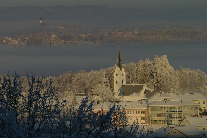 Winter scene in Gschwandt, Austria with snow and fog