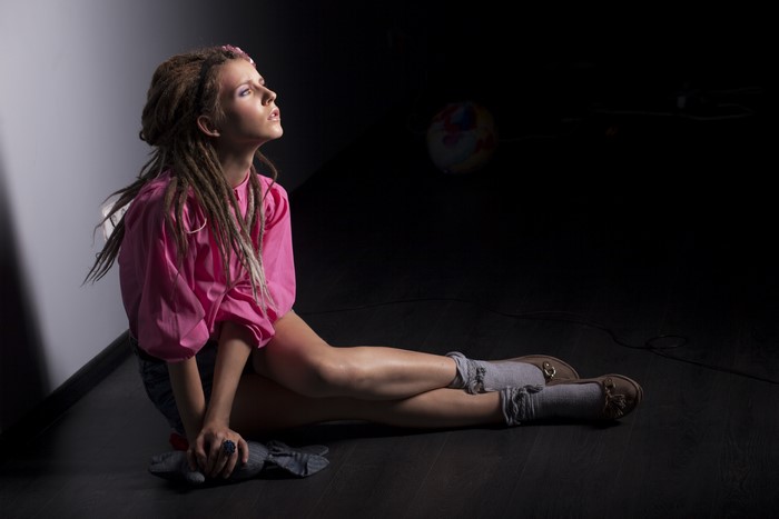 Model with Dreads Sitting and Posing
