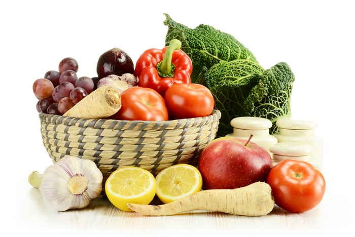Assortment of fresh vegetables and fruits in a basket