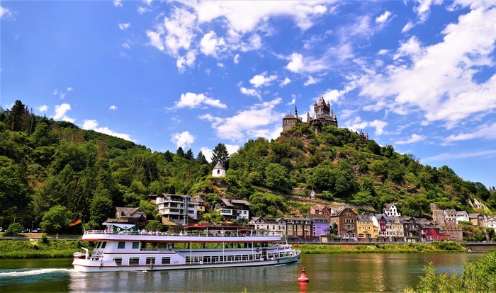 Riverboat passing Cochem Castle in Germany