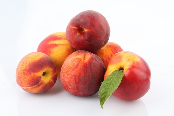 Peaches on a white background