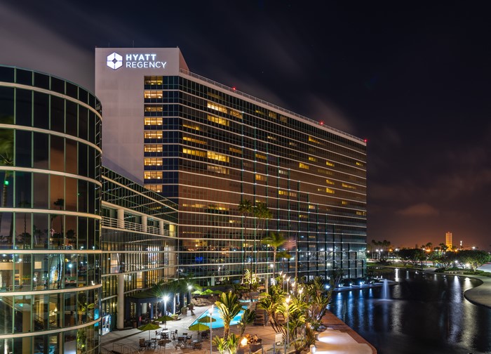 Hyatt Regency hotel at night with a water feature
