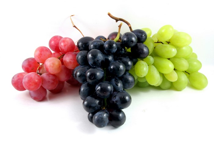 Multicolor grapes on white background