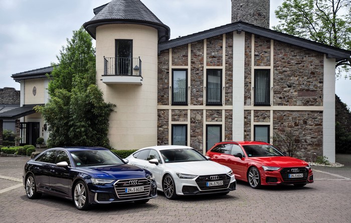 Three Audi S6 Cars in front of a Castle
