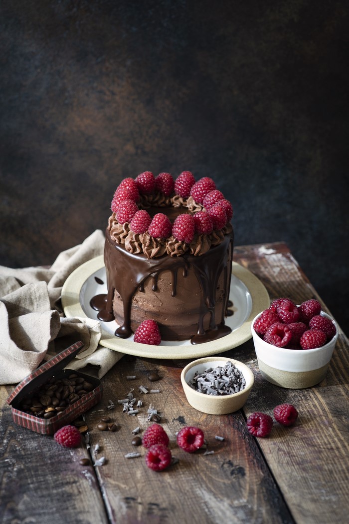 Chocolate cake with raspberries and chocolate drizzle