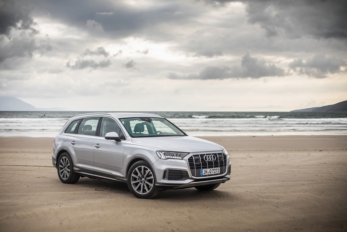 Silver Audi Q7 50 TDI quattro on a beach