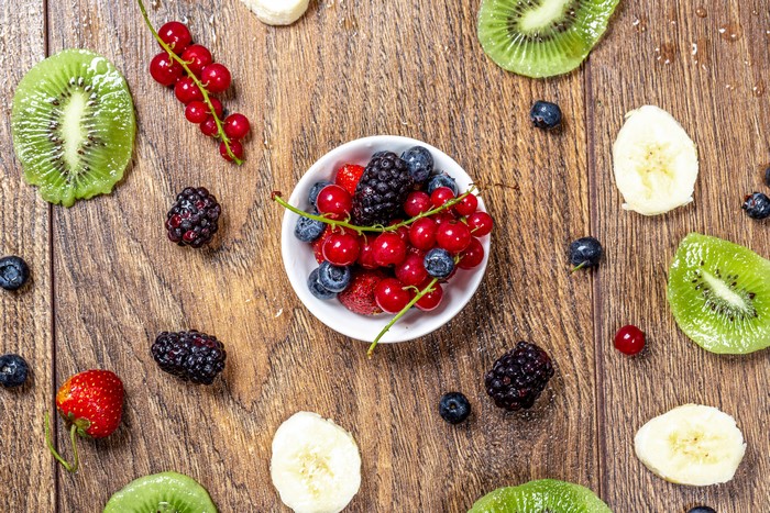Assortment of Fresh Berries and Fruits on Wood