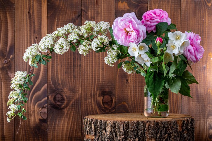 Bouquet of Roses and White Flowers on Wood