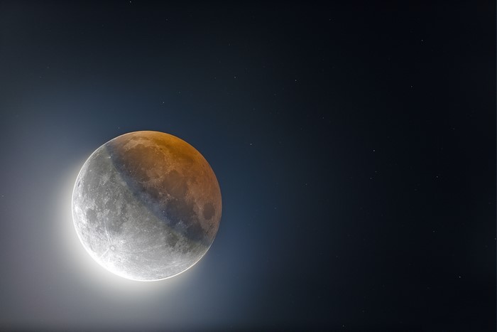 Eclipsed Moon in Starry Night Sky
