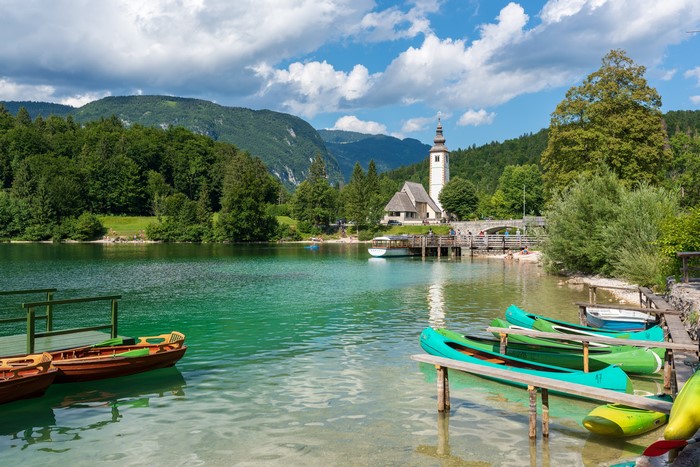 Lake Bohinj, Slovenia with boats and mountains