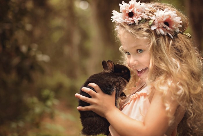 Girl with Flower Wreath Holding a Rabbit