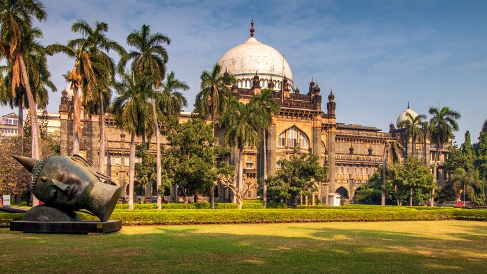 Prince of Wales Museum Mumbai with Buddha sculpture and palm trees