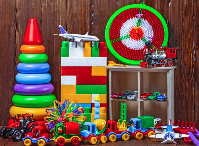 Collection of colorful toys including a train, airplane, and blocks