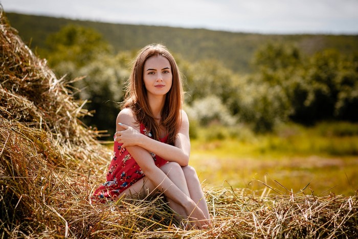 Alexey Gilev sitting in hay