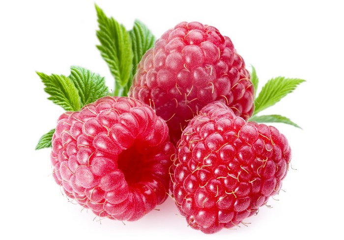 Three raspberries with green leaves on white background