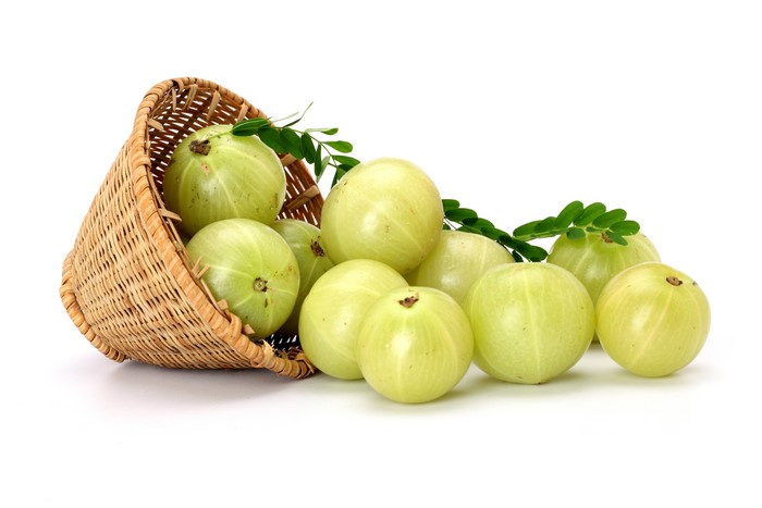 Gooseberries spilling from a wicker basket